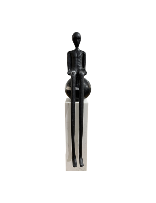 Long legged person on marble column