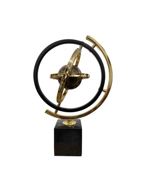 Small black and gold sphere on marble base