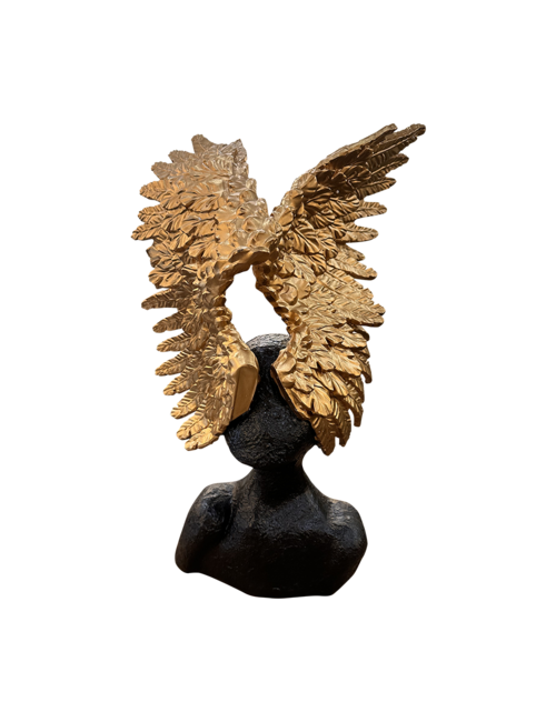 Gold wings on head sculpture